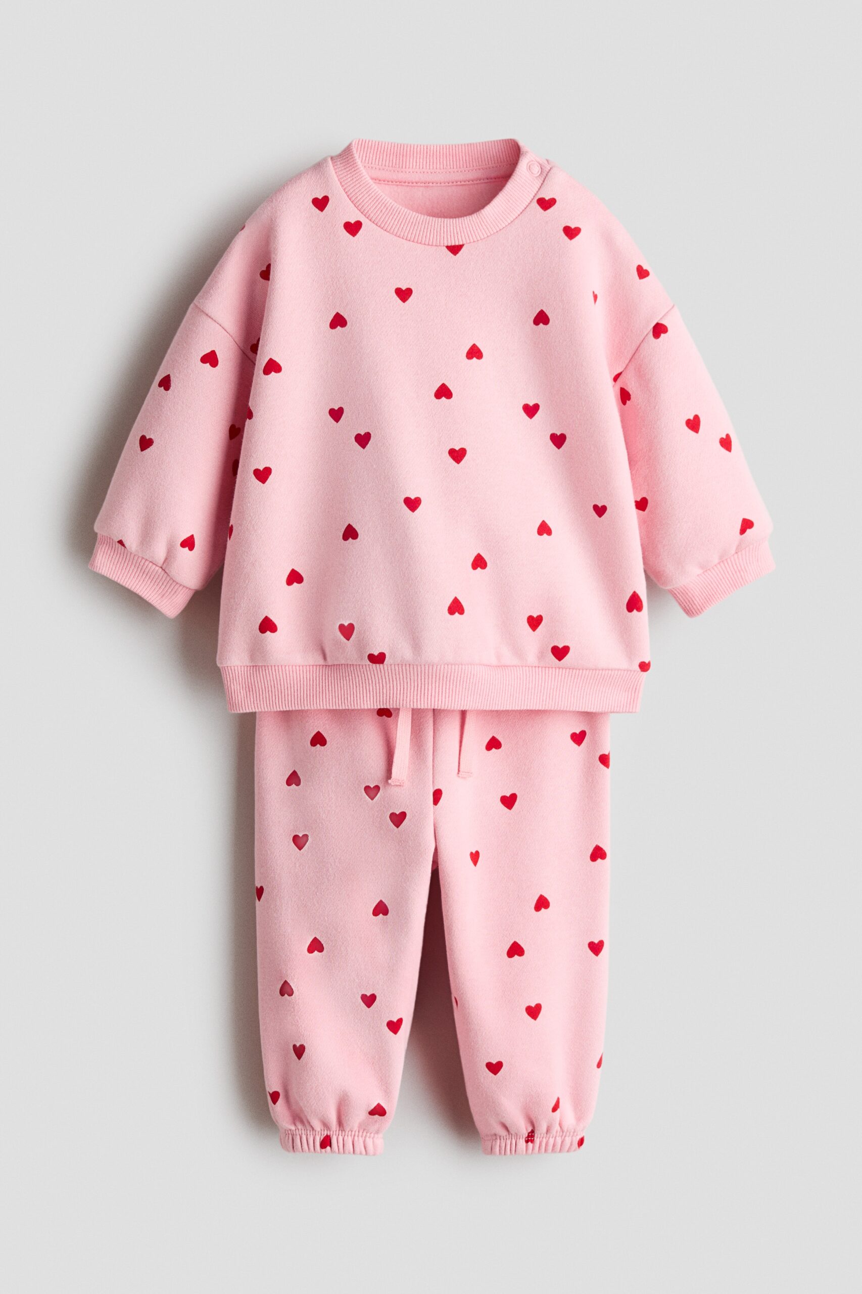H & M - Tweedelige set van joggingstof met print - Lichtroze/Hartjes