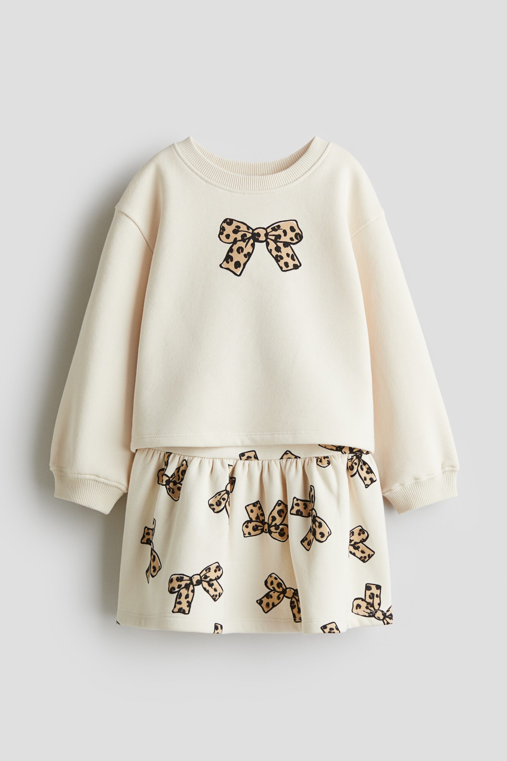 H & M - Tweedelige set - Sweater en rok - Roomwit/Strikjes