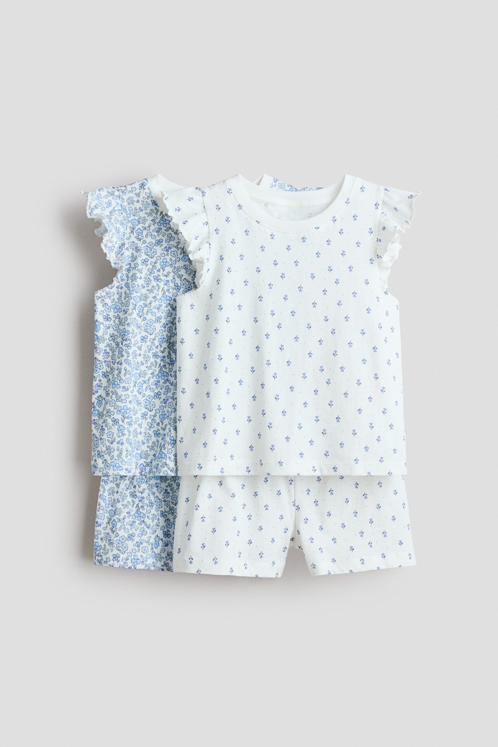 H & M - Set van 2 pyjama's met volantmouwtjes - Wit/Bloemen