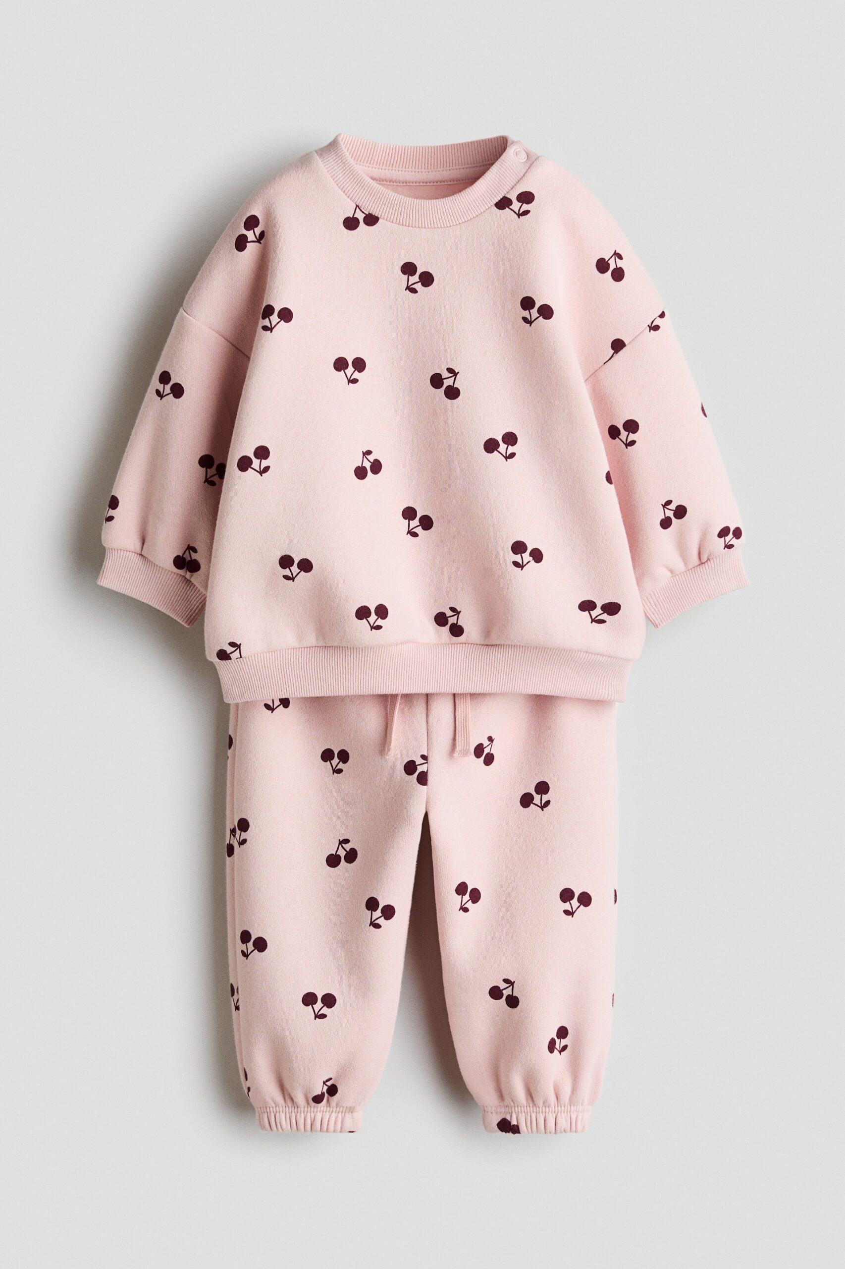H & M - Tweedelige set van joggingstof met print - Lichtroze/Kersen