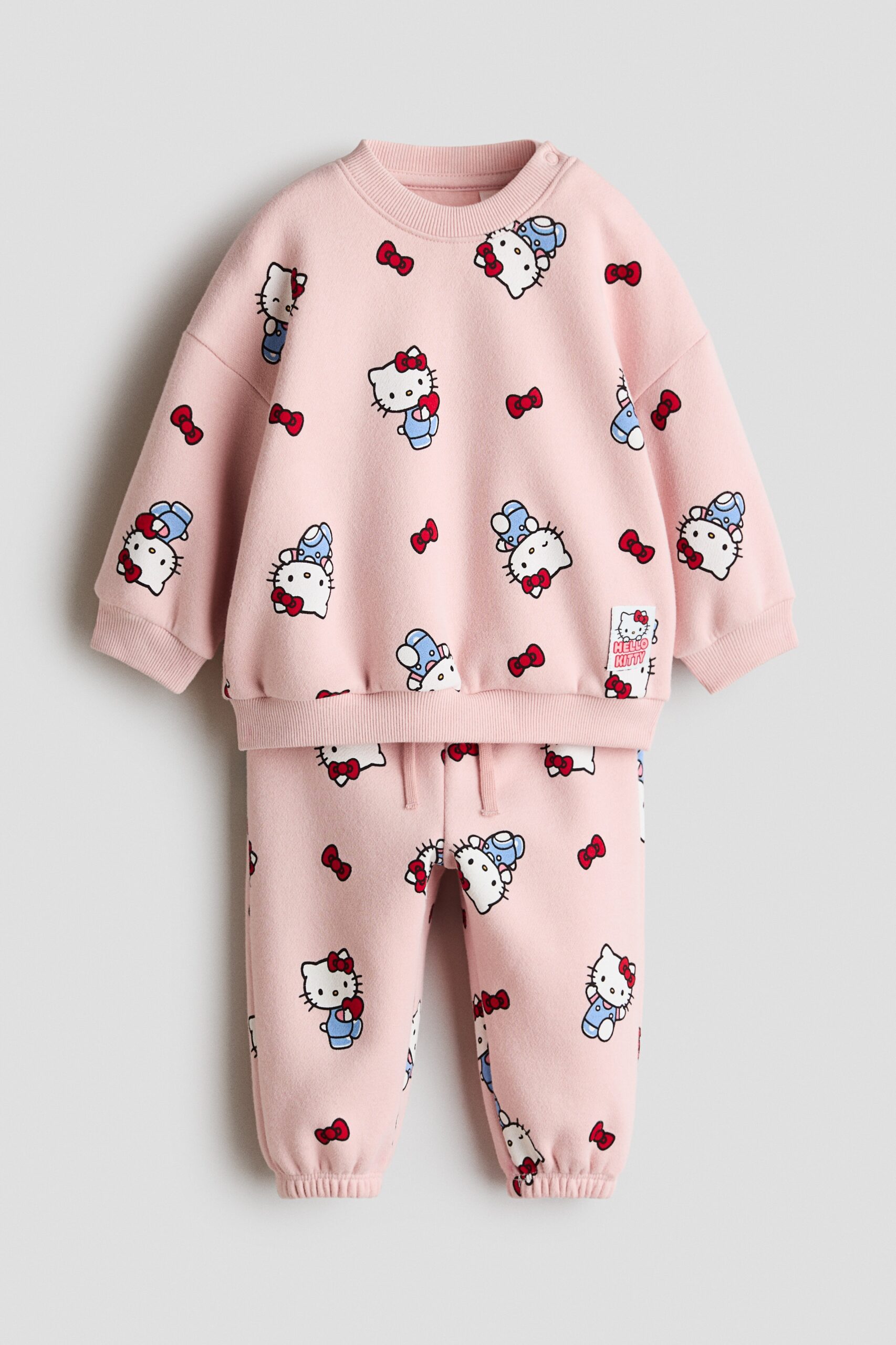H & M - Tweedelige set van joggingstof met print - Lichtroze/Hello Kitty